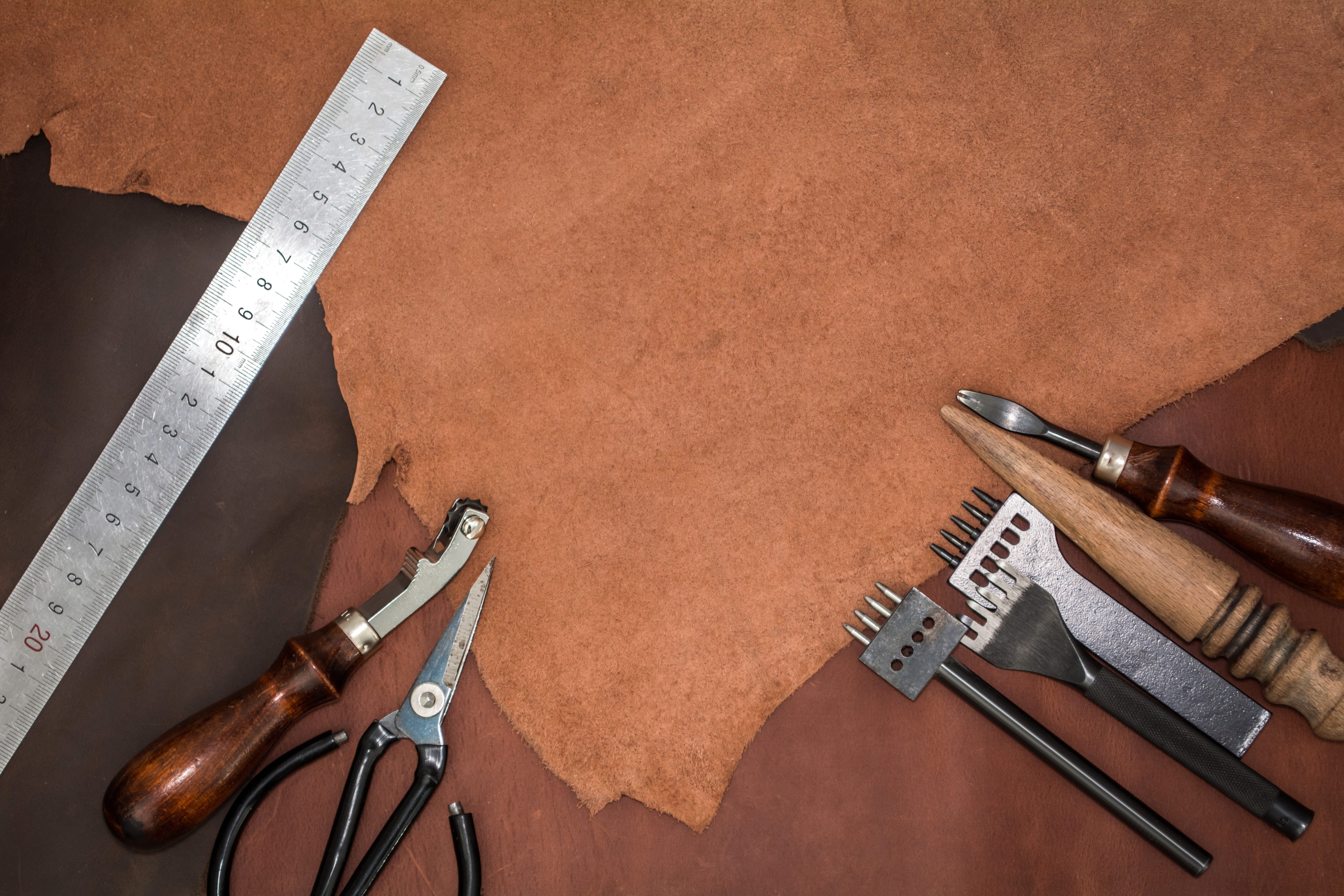 Leather crafting tools and pieces top view